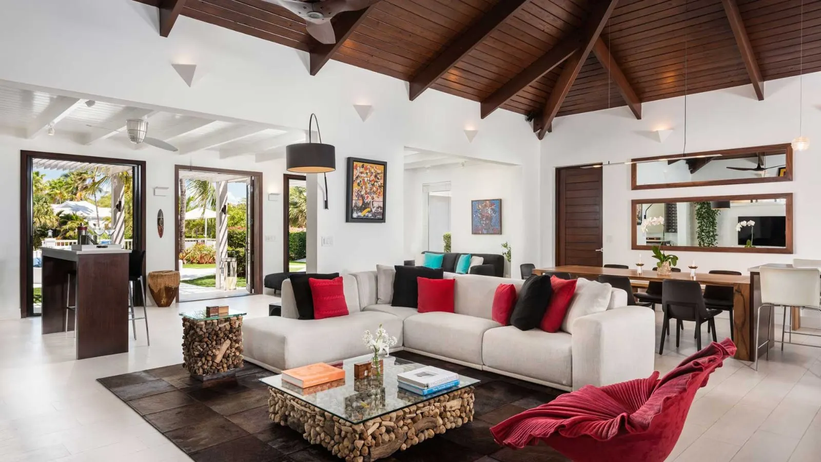 Living room with sofas, garden-view windows and Bose sound.